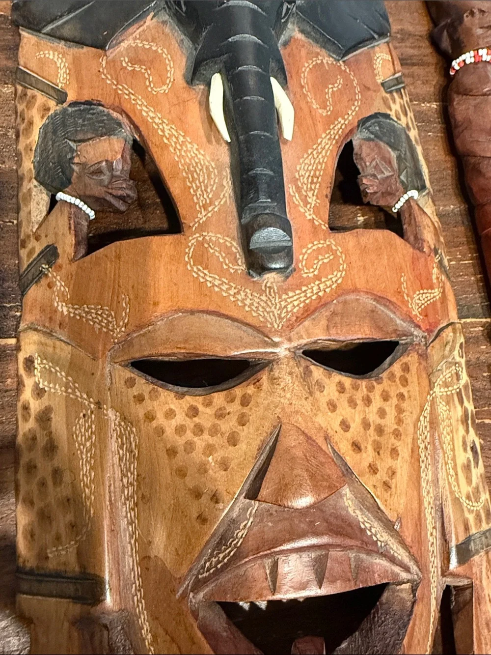 Hand-Carved Wooden Tribal Mask Wall Decor in Brown and Black
